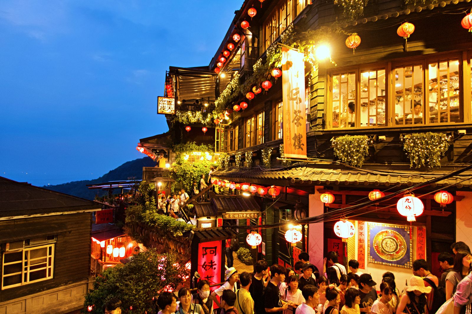 Jiufen tea houses and lanterns above the mountain coast at dusk