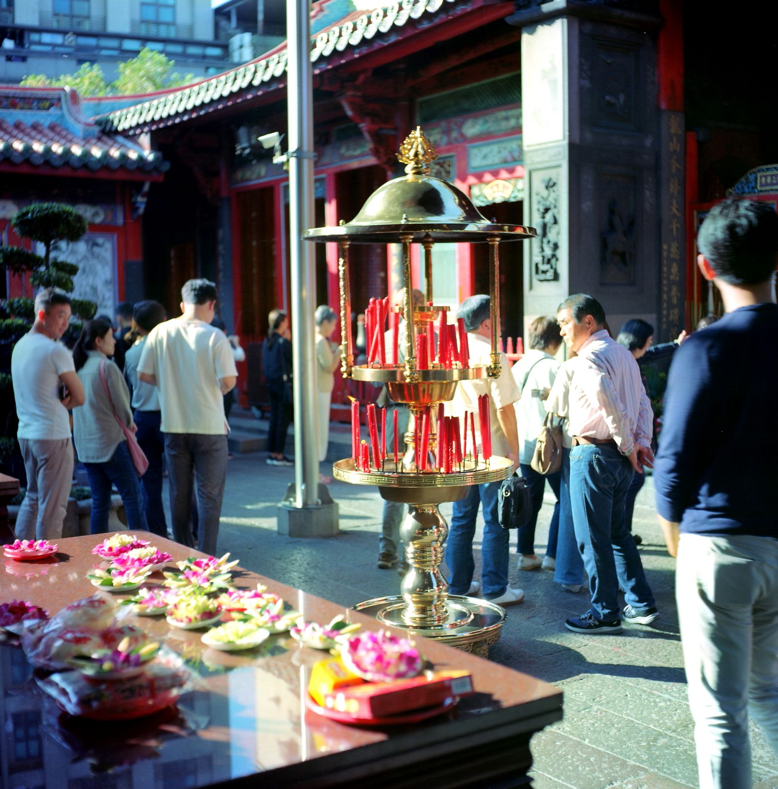 Worshippers and visitors around the incense burner at Longshan Temple
