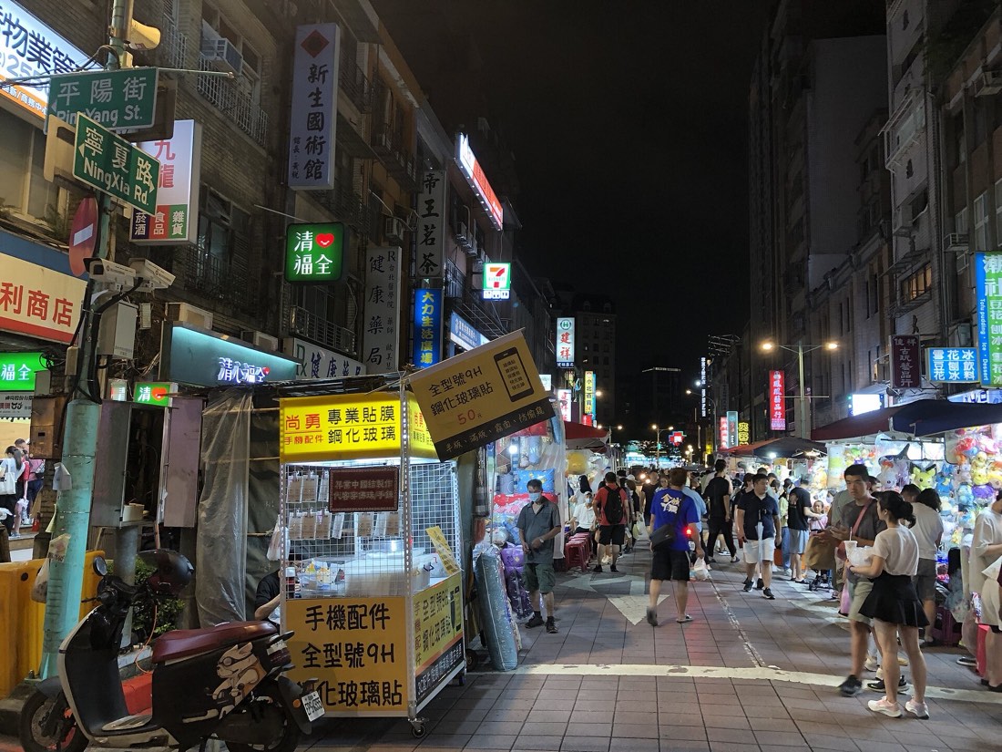 Crowds and illuminated food stalls on Ningxia Night Market